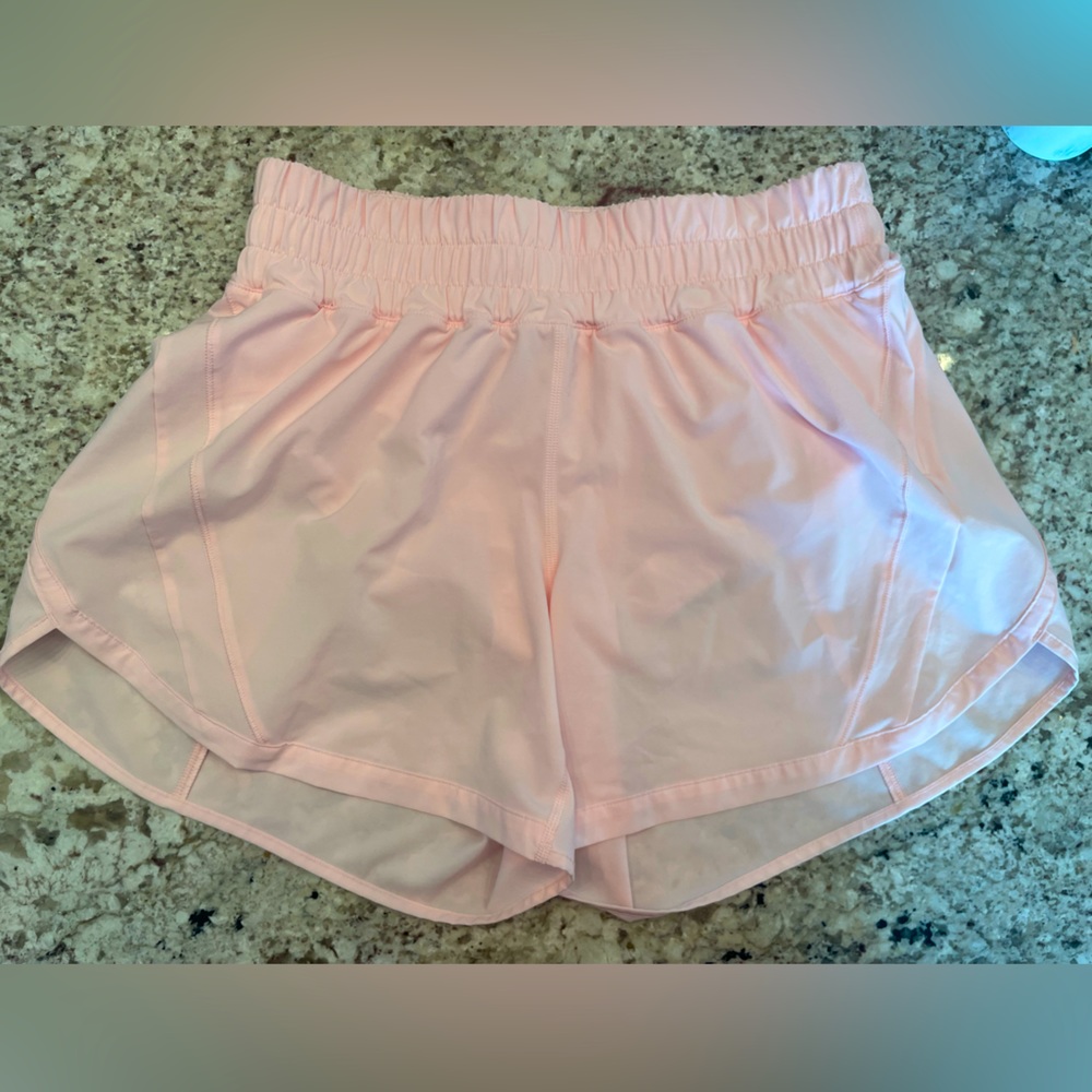 New without tags. Size 8. Track that, mid rise. 5 inch short. Light pink.